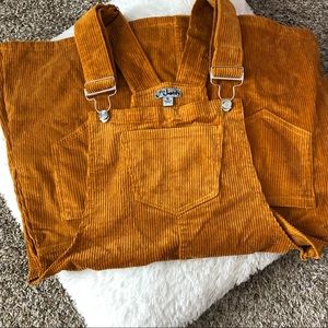 a burnt orange corduroyed overall dress